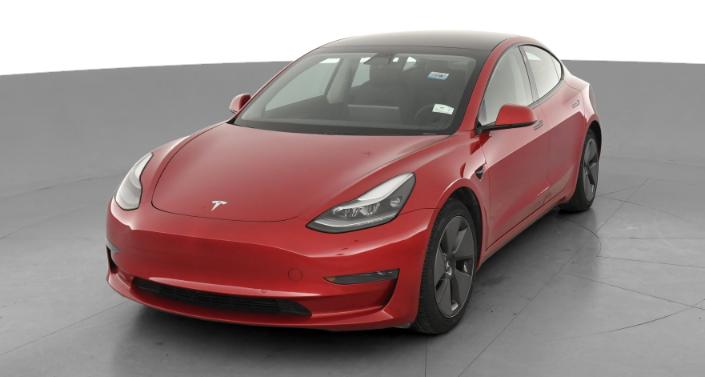 Futuristic Tesla Model Y SUV on Rocky Shore