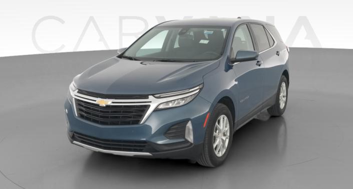 Used Chevrolet Equinox with awd drivetrain in gold or orange for