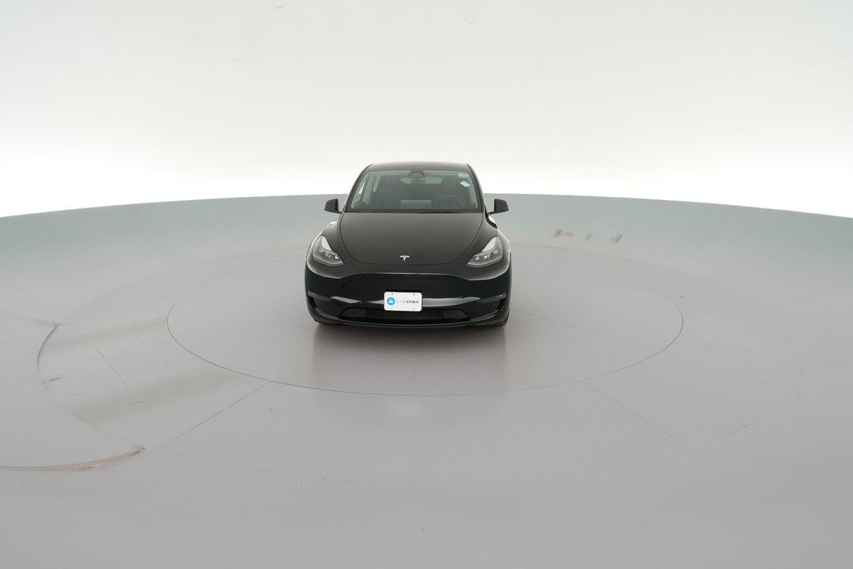 2025 Tesla Model Y Long Range All-Wheel Drive in Solid Black — 360° view 1