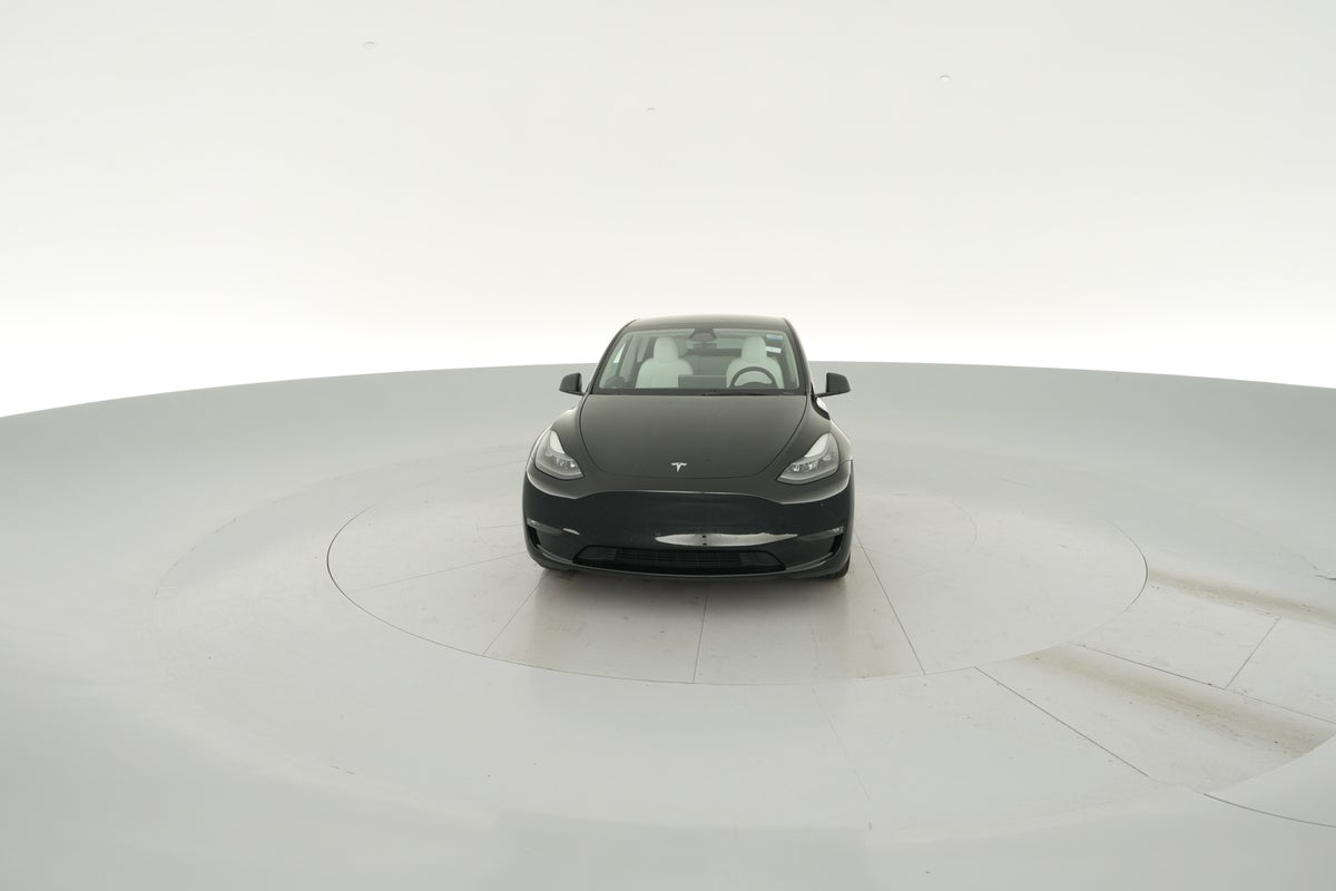 2024 Tesla Model Y Long Range All-Wheel Drive in Solid Black — 360° view 1