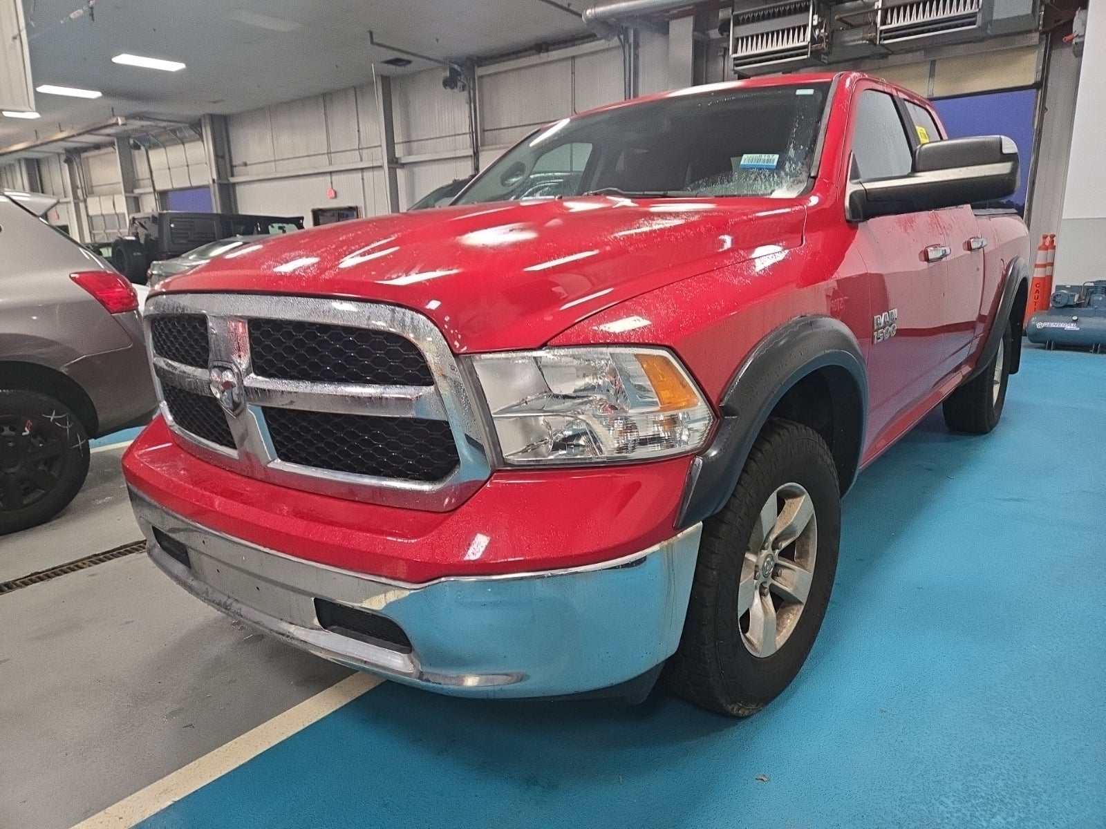 2014 Ram 1500 4WD Quad Cab 140.5" SLT